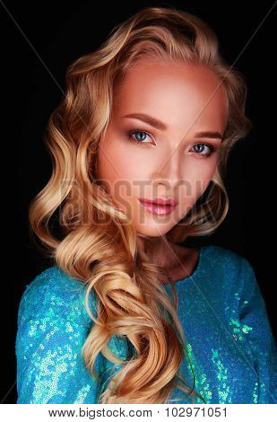 woman in blue dress on black background