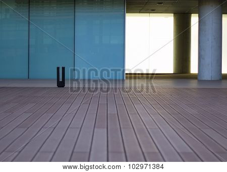 Wood floor with turquoise windows at the background