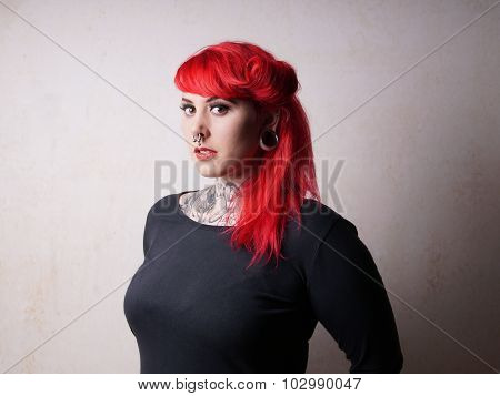 woman with tattoos and piercings