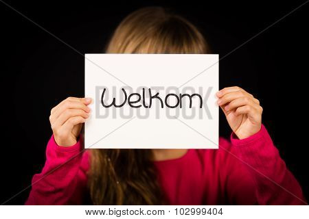 Child Holding Sign With Dutch Word Welkom - Welcome