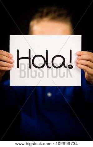 Child Holding Sign With Spanish Word Hola - Hello