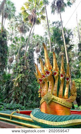 Seven headed serpent king or king of naga statue in Kamchanod forest ( Livistona saribus ) at 