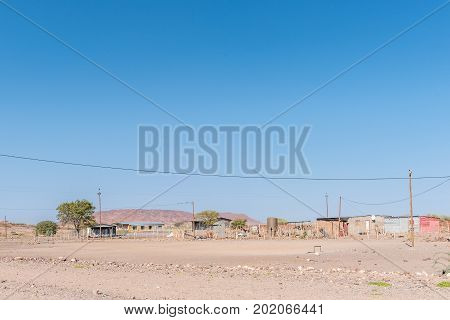 BERGSIG NAMIBIA - JUNE 28 2017: A street scene with houses in Bergsig a small village in the Kunene Region of Namibia