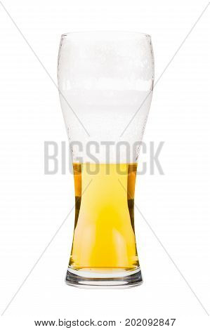 Tall beer glass almost full with lager beer, in the process of drinking. Someone already took a sip from the glass. Isolated on white