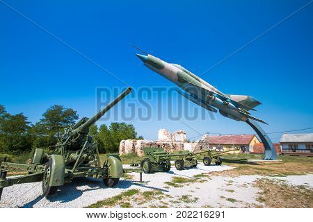Karlovac, Croatia, August 27, 2017: Old cannon and Russian fighter jet in military open air museum in Turanj, Karlovac, Croatia