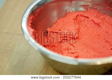 cooking, food and baking concept - macaron batter or ice cream in bowl