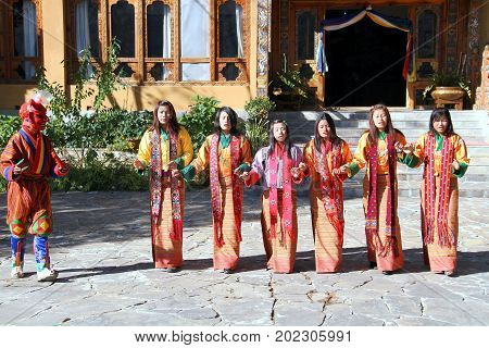 PARO BHUTAN - November10 2012 : Unidentified young singers and dancers in traditional Bhutanese dress singing and performs traditional dance. Paro Bhutan