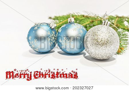 Merry Christmas and decorative ball on the white background