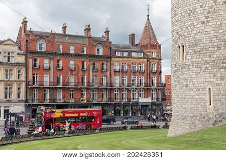 WINDSOR ENGLAND - JUNE 09 2017: Streetview of Thames Street outside the walls of Windsor castle