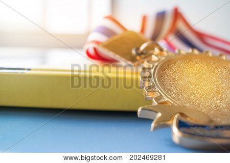golden medals on book graduate education in university Competitions and Education study concepts. Success in study famous institution Concept of winner abroad international.