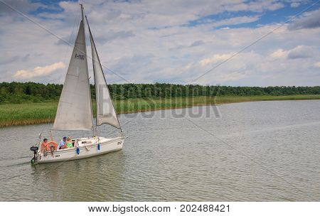 Sniardwy Lake, Poland-JUNE 232008:Small yacht sailing accross Sniardwy Lake, Mazurian Region, Poland, Europe