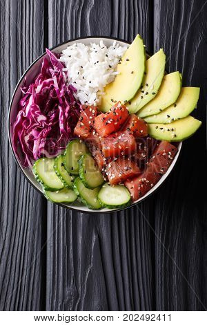 Raw Organic Ahi Tuna Poke Bowl With Rice And Veggies Close-up. Vertical Top View