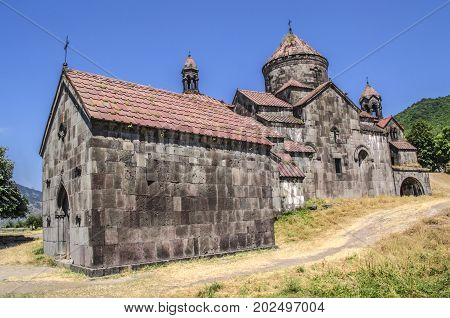 Side view of the monastery Gregory the Illuminator and the gavit of St.Nshan in the Armenian village of Haghpat