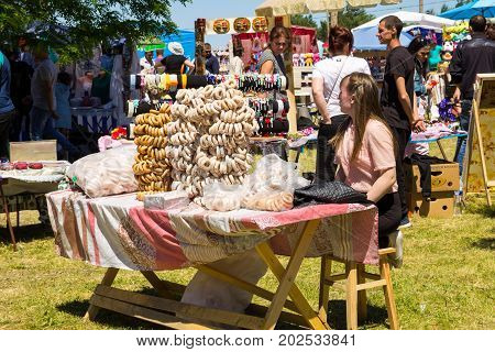 Girl Is Selling Bagels During Strawberry Festival