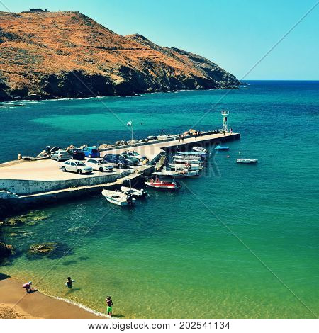 Traditional beautiful Greek village of Panormos on the island of Crete. Summer background for travel and holidays.