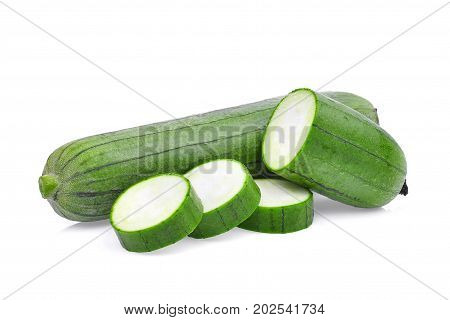 fresh green sponge gourd or luffa with slice isolated on white background