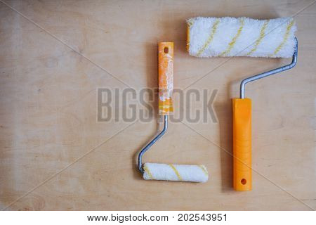Set of instruments for making repair on wooden background in details