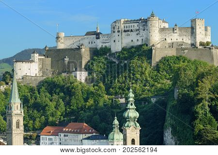 Hohensalzburg Castle in Austria, view from Moenchsberg. High Salzburg Fortress sits atop the Festungsberg, a small hill in the Austrian city of Salzburg. One of the largest medieval castles in Europe.