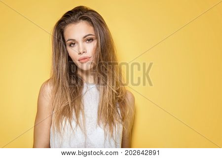 Portrait Of Young Brunette Woman With Brown Eyes.