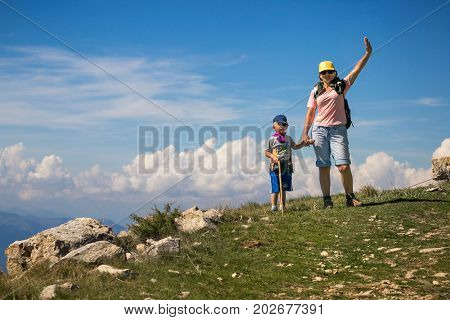 Mount Baldo, Italy - August 15, 2017: Happy Mother With Her Son Atop A Hill In San Marino.
