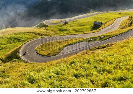 Motorcycle drivers riding in Alpine highway,  Hochalpenstrasse, Austria, Europe. Outdoor photography, mountain landscape. Travel and sport photography. Speed and freedom concept