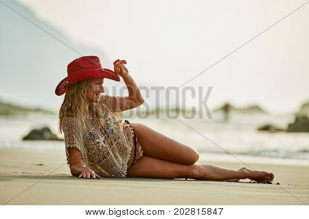 young woman relaxing on the beach in summer day