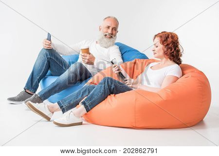 Couple With Coffee And Gadgets