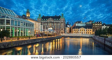 Panoramic view of Malmo skyline from canal in the evening Sweden
