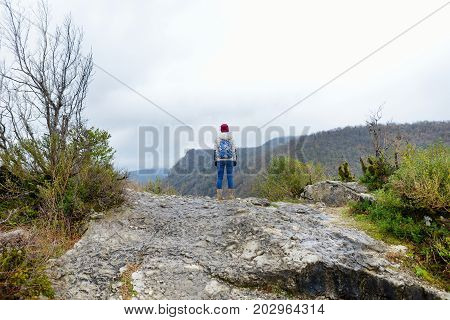 Female Tourist Hiking On Cliff-top Promontory Above A Bend Of The Tskhaltsitela River