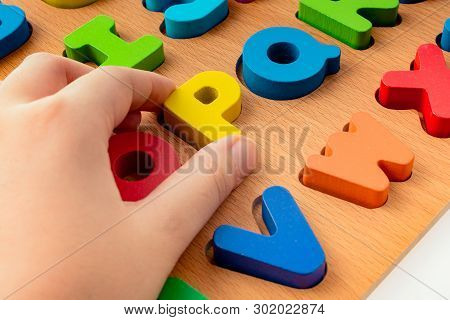 Colorful Letter Of Alphabet P Made Of Wood In Hand