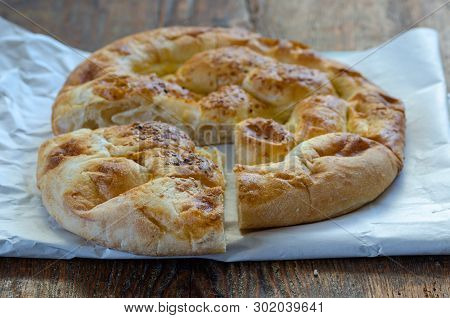Slices Of Ramadan Pita (ramazan Pidesi) Traditional Turkish Bread For Holy Month Ramadan On Wooden B