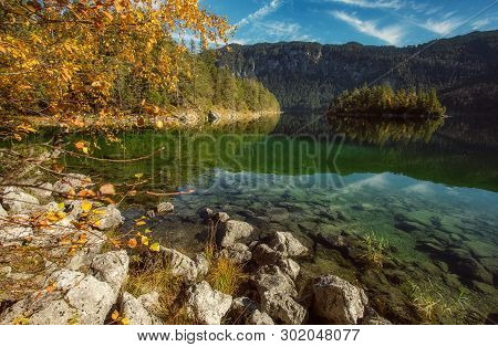 Impressive Autumn Landscape The Eibsee Lake In Front Of The Zugspitze Under Sunlight. Amazing Sunny 