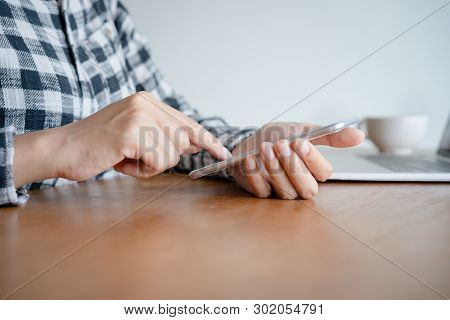 Business Woman Using Smartphone On Desk At Home Office. On The Modern Table Working Have Laptop And 