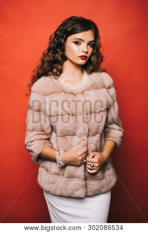 Perfect For Winter Cold. Young Woman In Elegant Winter Coat. Pretty Woman In Fashionable Fur Coat. F