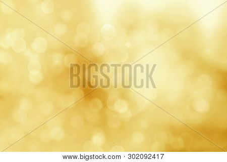 Golden Abstract Christmas Lights. Christmas Soft Gold Bokeh Background