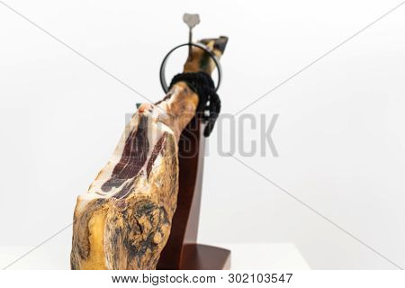 Spanish Delicatessen Dry Cured Meat Ham, Whole Leg, Jamon Iberico Bellota On Jamonero Stand Selectiv