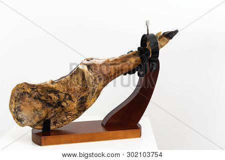 Spanish Delicatessen Dry Cured Meat Ham, Whole Leg, Jamon Iberico Bellota On Jamonero Stand Selectiv
