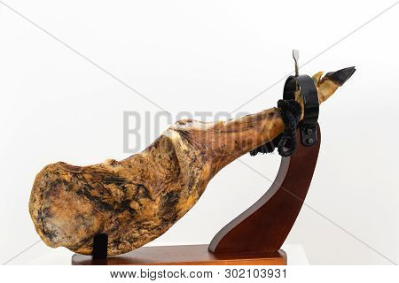 Spanish Delicatessen Dry Cured Meat Ham, Whole Leg, Jamon Iberico Bellota On Jamonero Stand Selectiv