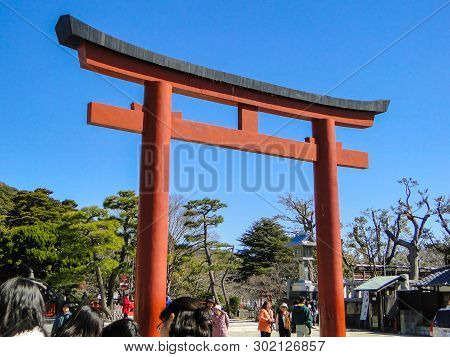 2011 March 04. Kamakura Japan. A Red Torii (gate) At Tsuruoka Hachimangu With Tourist On Sunny Day I