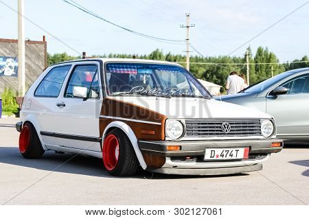Moscow. Russia - May 20, 2019: White Tuned In Stance Style Volkswagen Golf Mk 1. Low Car With Wide R