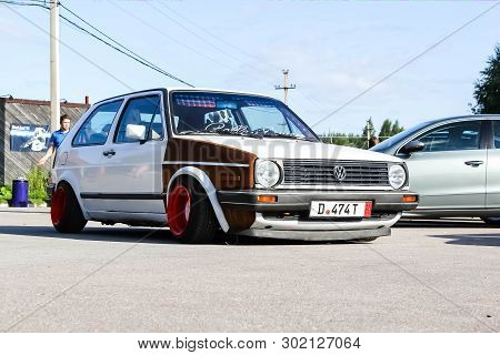 Moscow. Russia - May 20, 2019: White Tuned In Stance Style Volkswagen Golf Mk 1. Low Car With Wide R