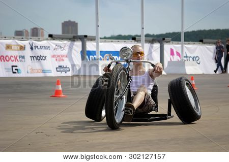 Moscow. Russia - May 20, 2019: A Man Rides At The Street On A Homemade Tricycle. On Trike. These Bor