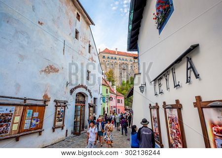 Krumlov, Czech Republic - 21 September 2018: View of Cesky Krumlov narrow street with beautiful ancient arcitecture and tourists