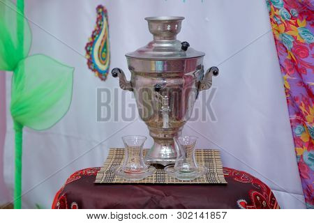 Crystal Glass Of Tea On With Metal Samovar . Azerbaijan Tea Samovar Concept Traditional Azerbaijan C