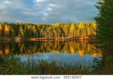 The Forest Lake At Sunset, With Reflection Of Sky And Forest On A Water Smooth Surface, Russia, Mari