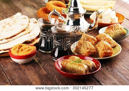 Middle Eastern Or Arabic Dishes And Assorted Meze, Concrete Rustic Background. Turkish Bread Or Turk