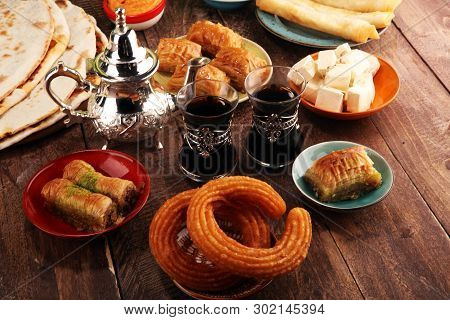 Middle Eastern Or Arabic Dishes And Assorted Meze, Concrete Rustic Background. Turkish Bread Or Turk