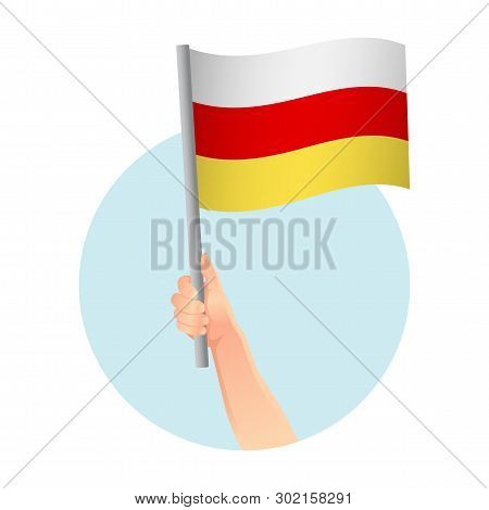 South Ossetia Flag In Hand. Patriotic Background. National Flag Of South Ossetia Vector Illustration
