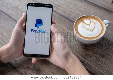 Chiang Mai, Thailand - May 11, 2019 : Man Hands Holding Oneplus 6 With Paypal Apps On The Screen. Pa