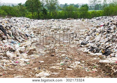 Garbage Dump Pile In Trash Dump Or Landfill,truck Is Dumping The Gabage From Municipal,pollution Con